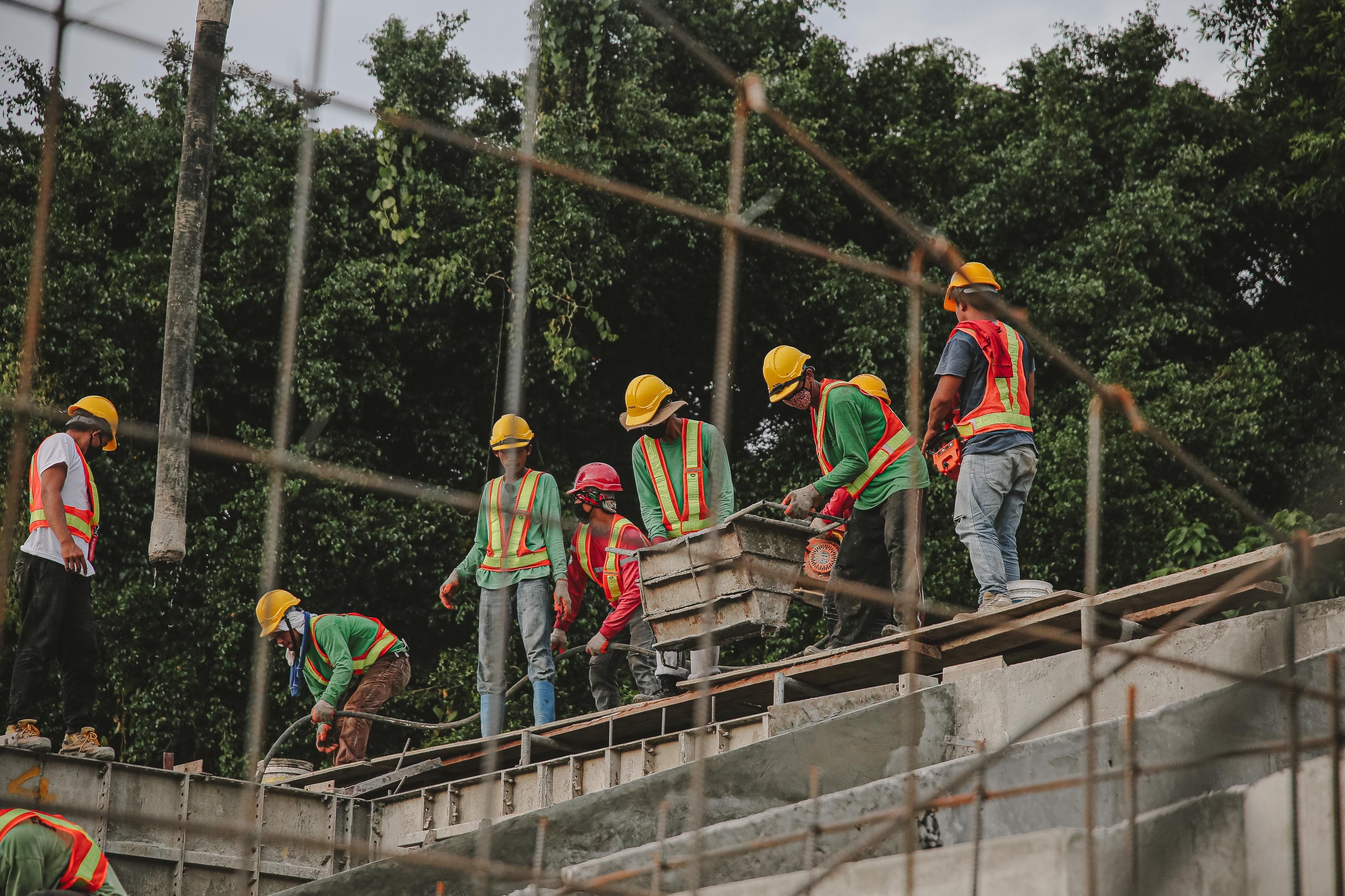 An overhead view of a construction crew working on rebar and concrete formwork