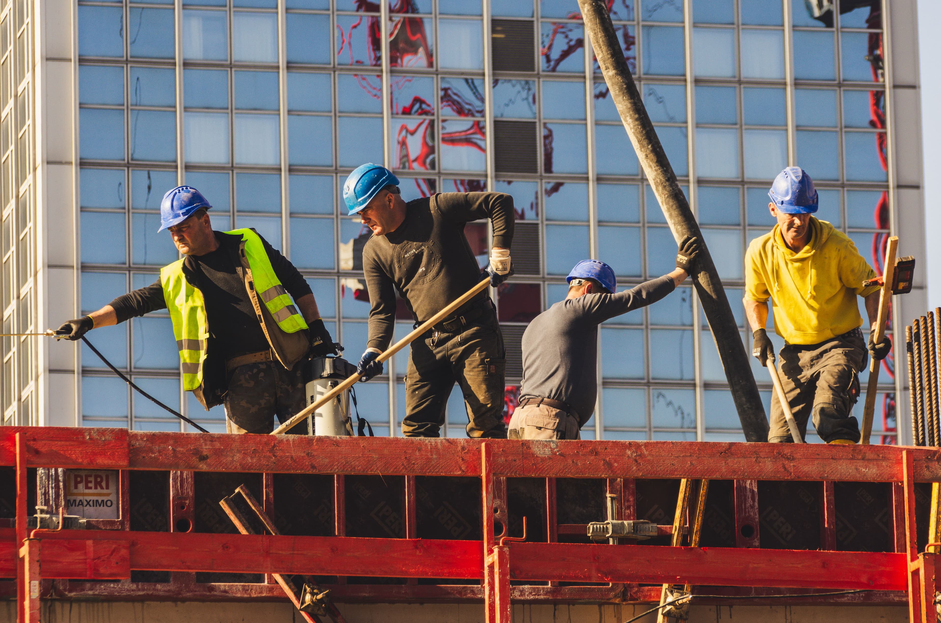 A crew working on formwork at a commercial high-rise construction site